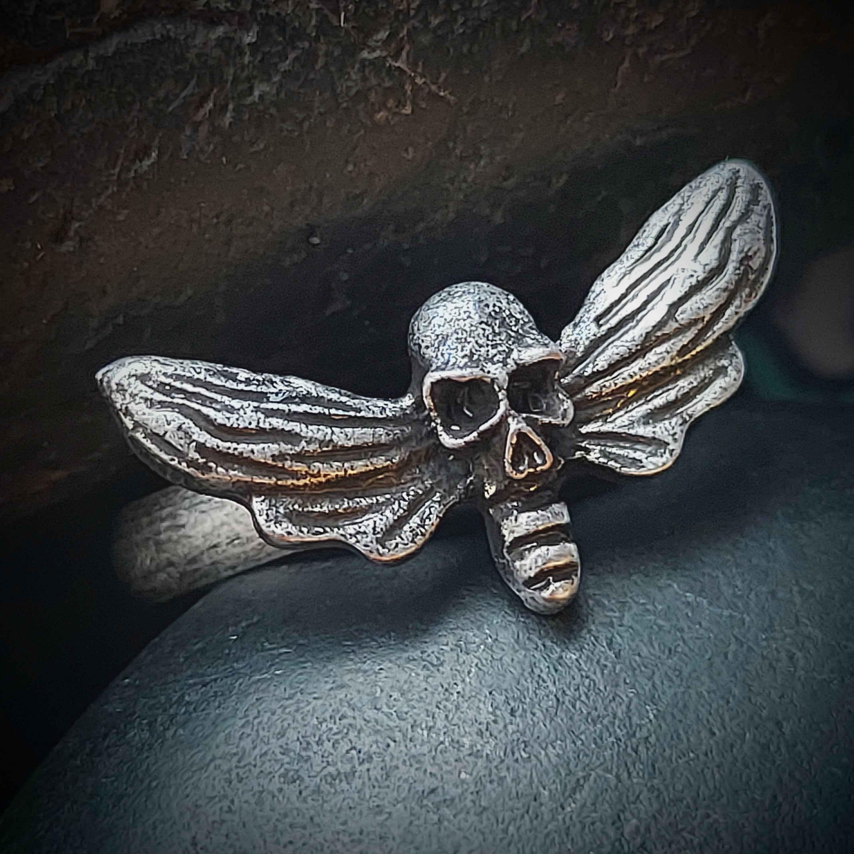 Death deals moth ring